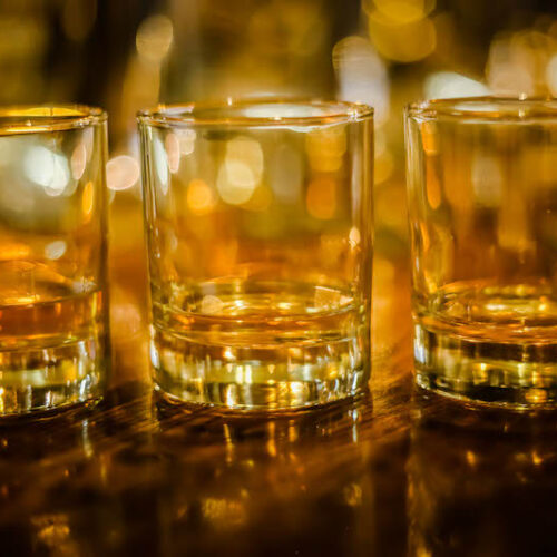 Three tumbler glasses with Scotch whisky