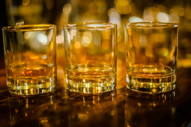 Three tumbler glasses with Scotch whisky