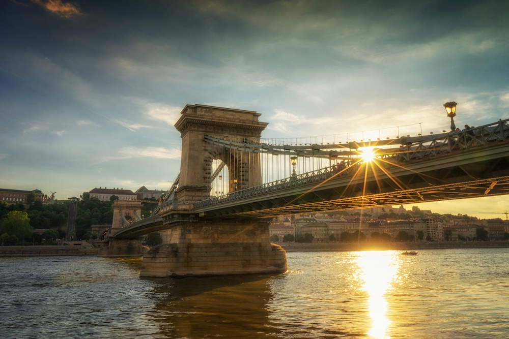 Sunburst over Budapest Chain Bridge at start of Eastern Europe River Cruise