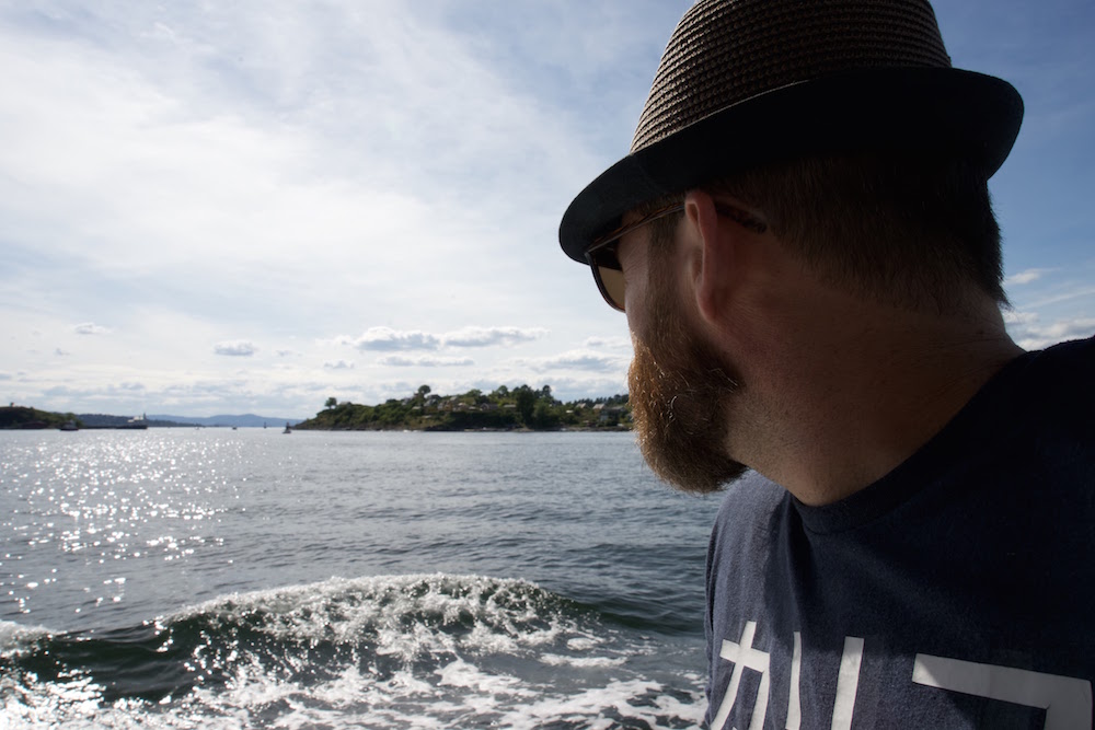 A man on a public ferry in Oslo Fjord