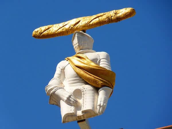 A statue with bread on its head at Dali Museum in Figueres Spain