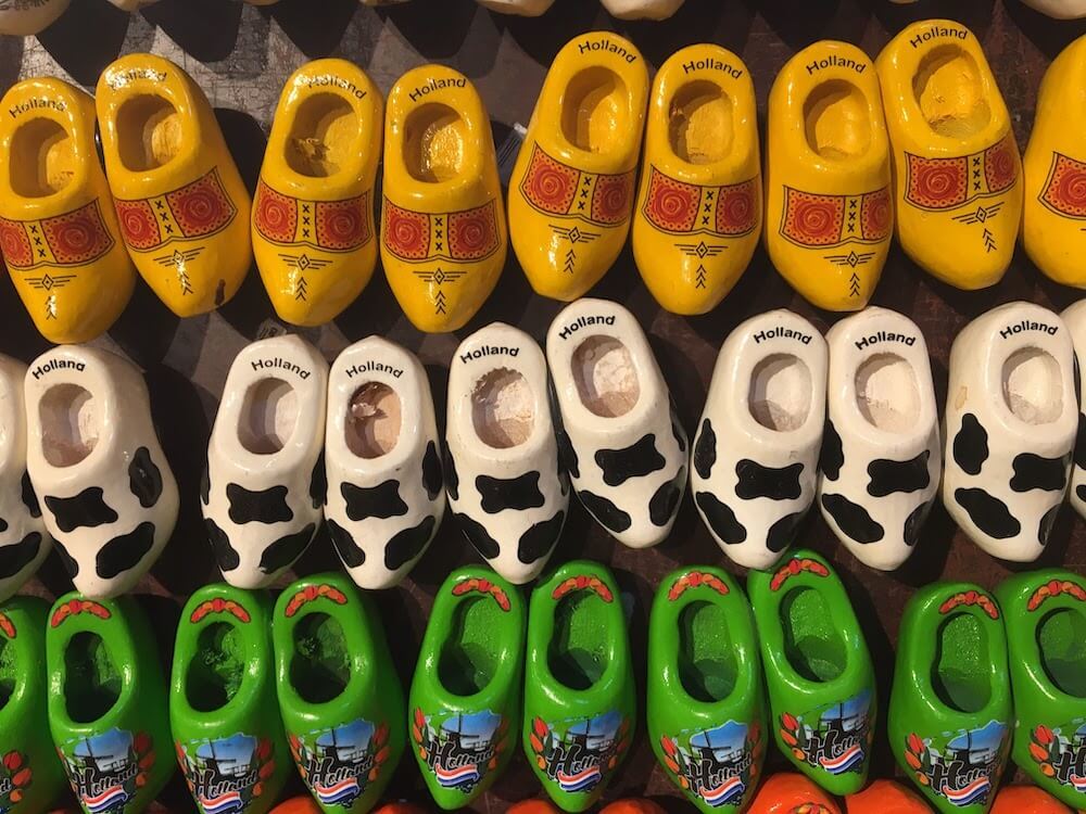 A detail of colorful wooden shoes on a wall in the netherlands