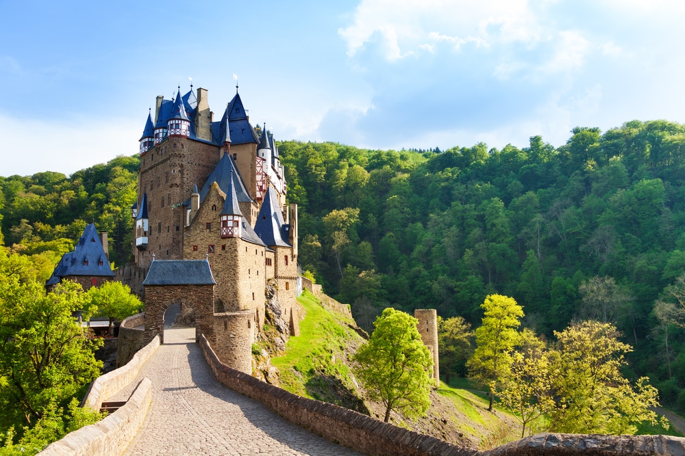 Road to the Eltz castle with towers in the forest, Rhineland-Palatinate, Germany, Europe