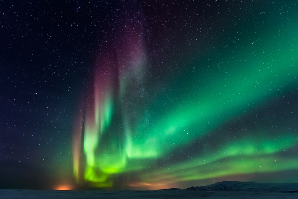 Northern lights above snowy plain