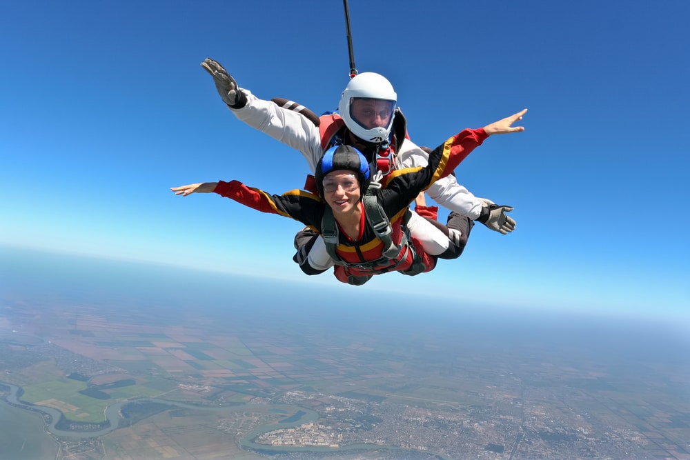 tandem skydivers in the air