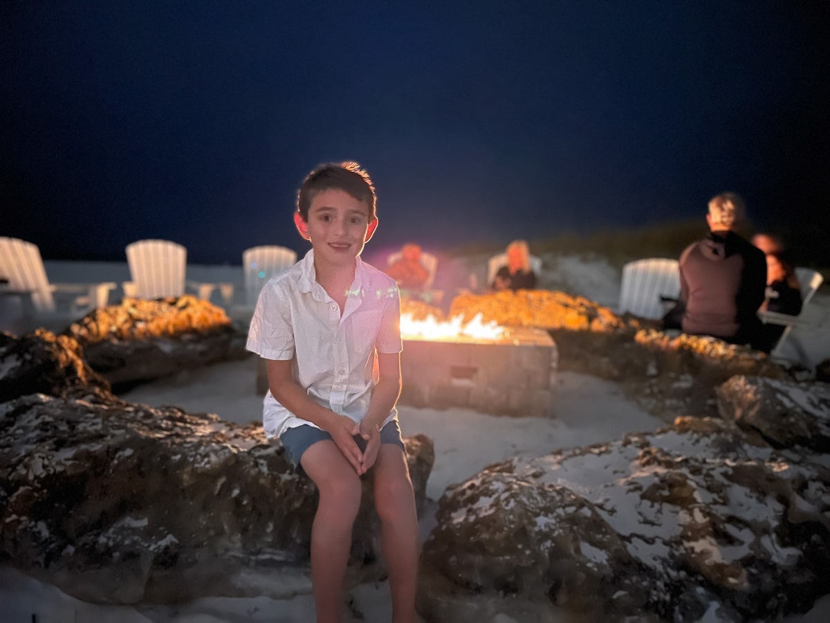 my son sitting by the fire pit at the Sandpearl in Clearwater Beach