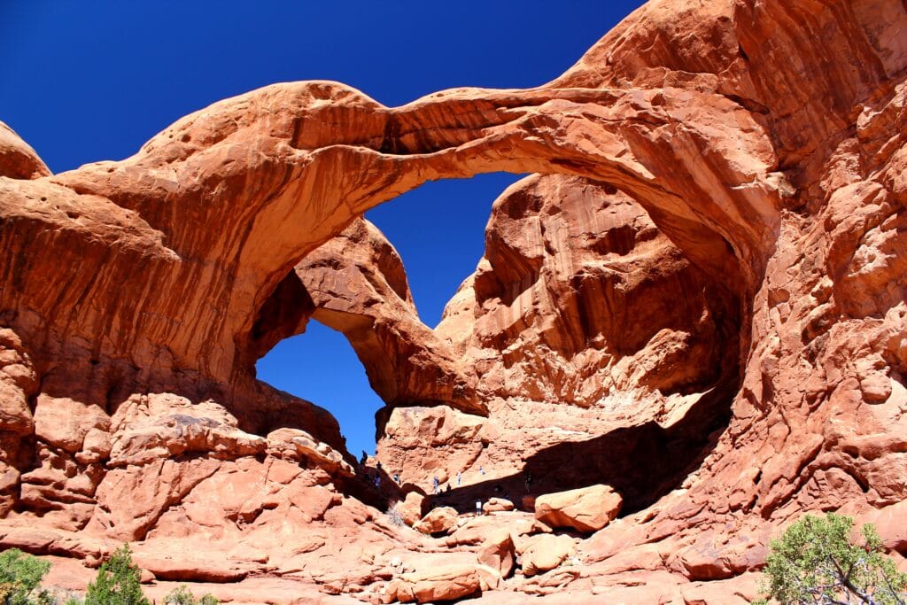 view of multiple red sandstone arches in arches national park