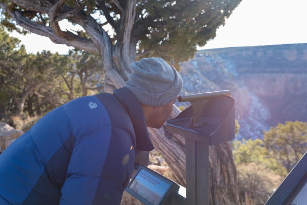using a viewing scope on the Rim Trail in the Grand Canyon