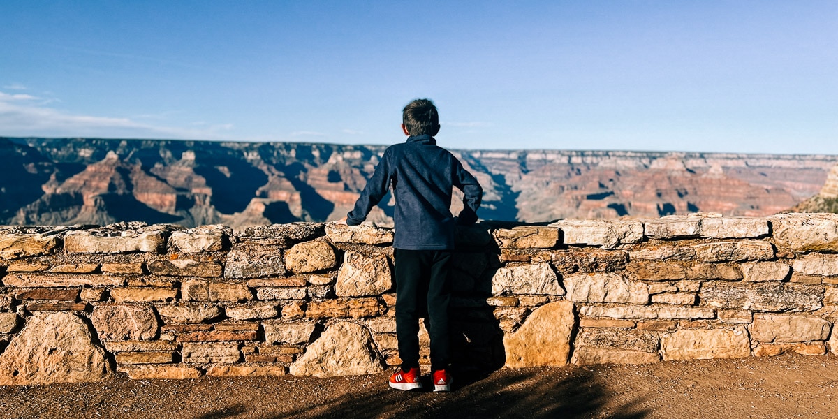 kid taking in the view at Grand Canyon