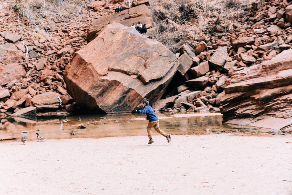 boy at Upper Emerald Pool in ZIon