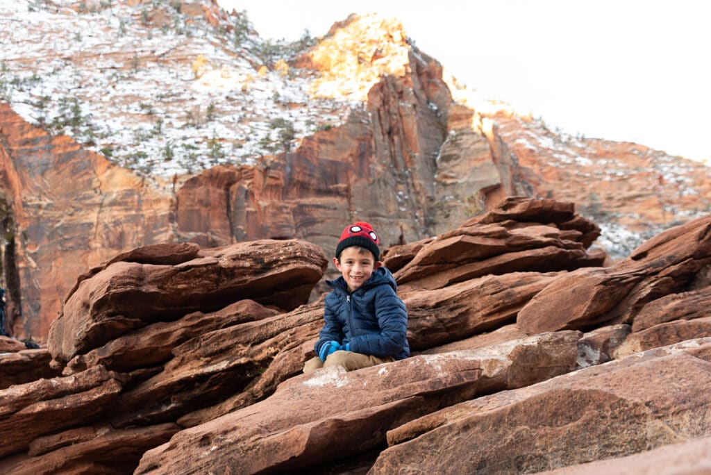 boy at top of Canyon Overlook Trail