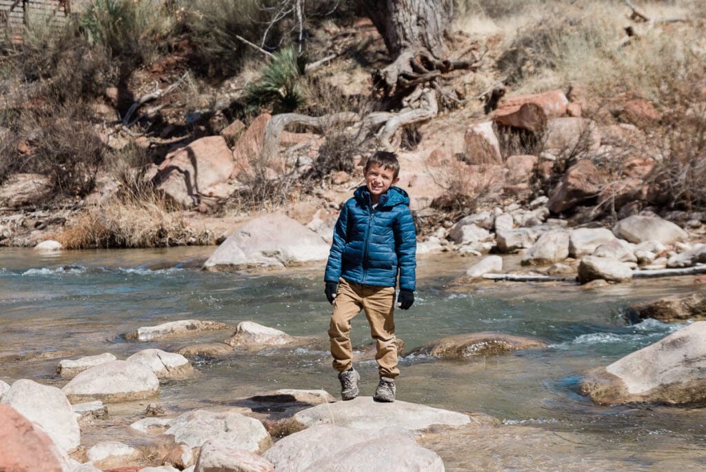 boy hiking Pa'Rus Trail at Zion National Park