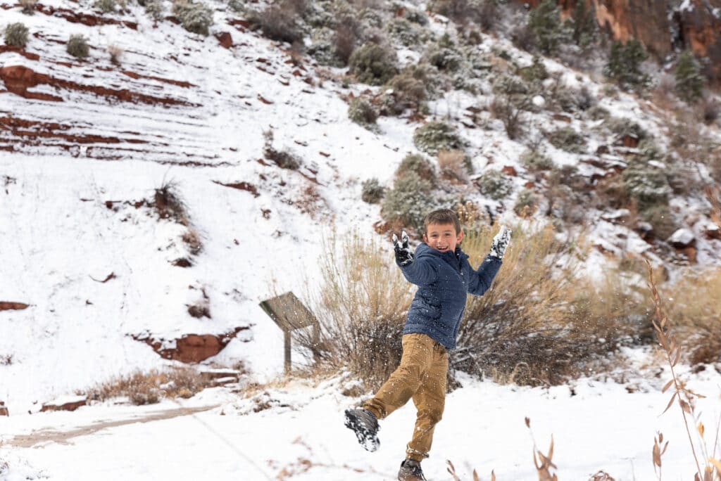 my son throwing snowballs