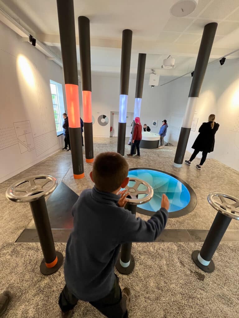 My son playing with an exhibit at Ljosafoss Power Station