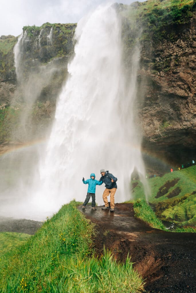 My husband and son in front of Seljalandsfoss Waterfall