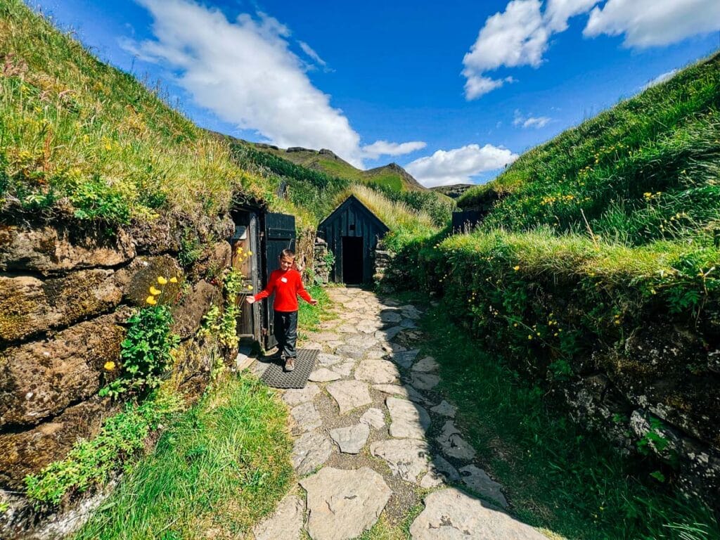 my son in the Turf houses at Skogar Museum