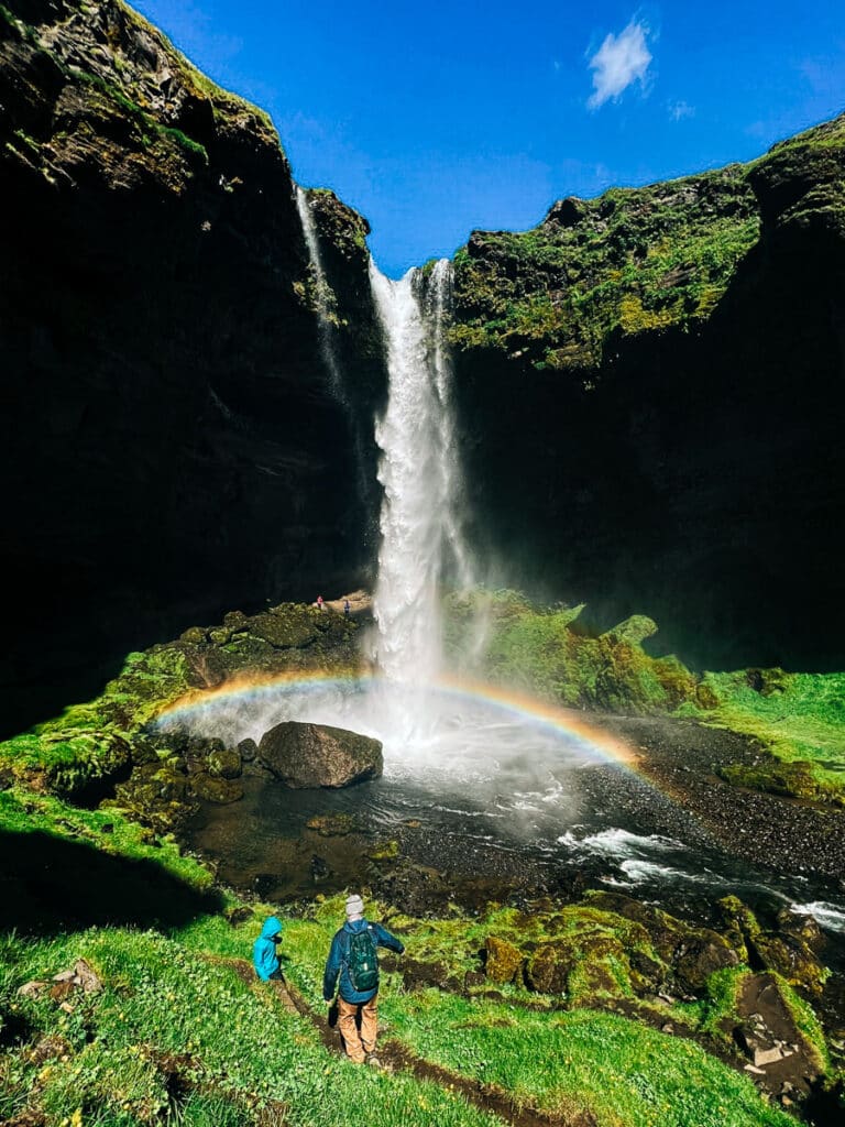 My husband and son hiking to the bottom of Kvernufoss Waterfall