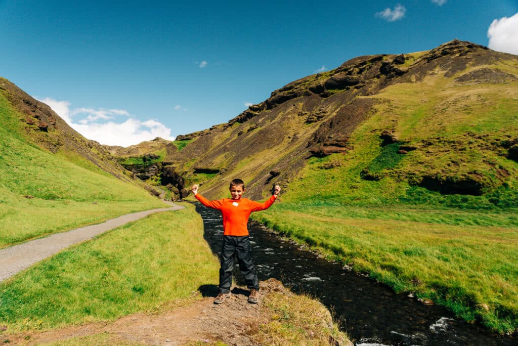 my son on the trail to Kvernufoss Waterfall