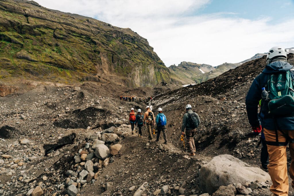tour group walking on a glacier hike