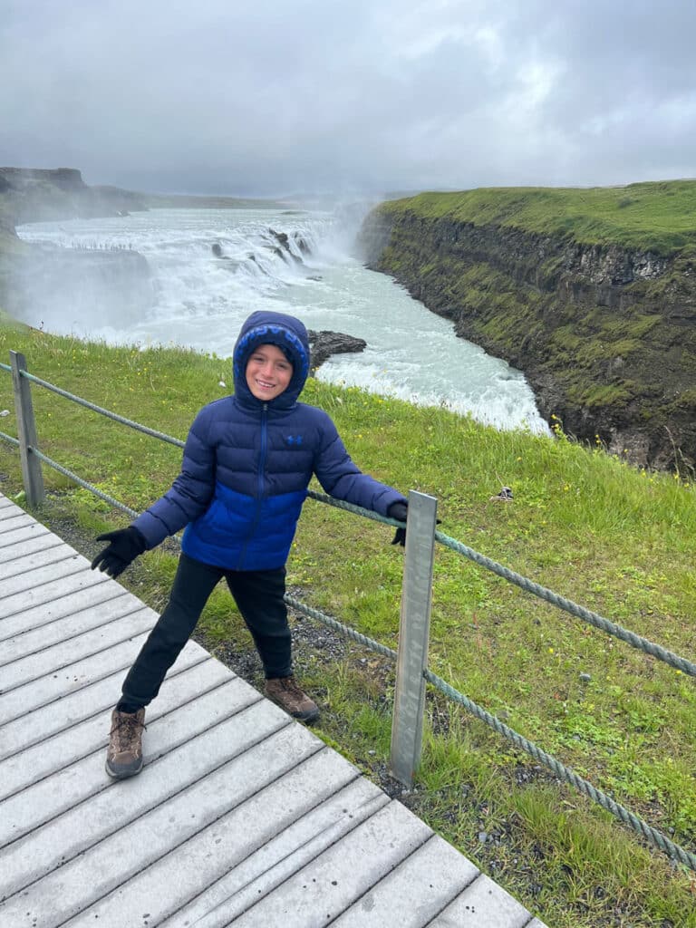 my son in front of Gullfoss Waterfall