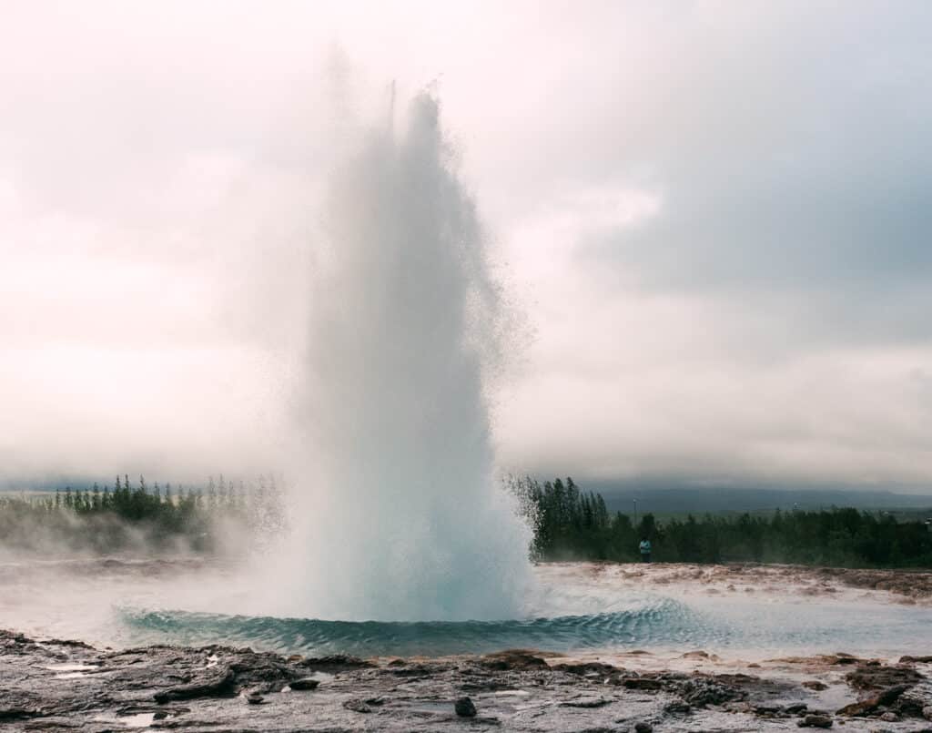 Strokkur Geyser erupting at Geysir Hot Springs in Iceland