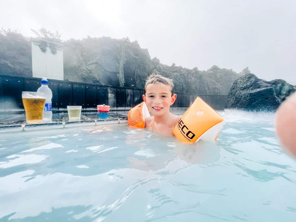 my son enjoying an icee at Blue Lagoon in Iceland