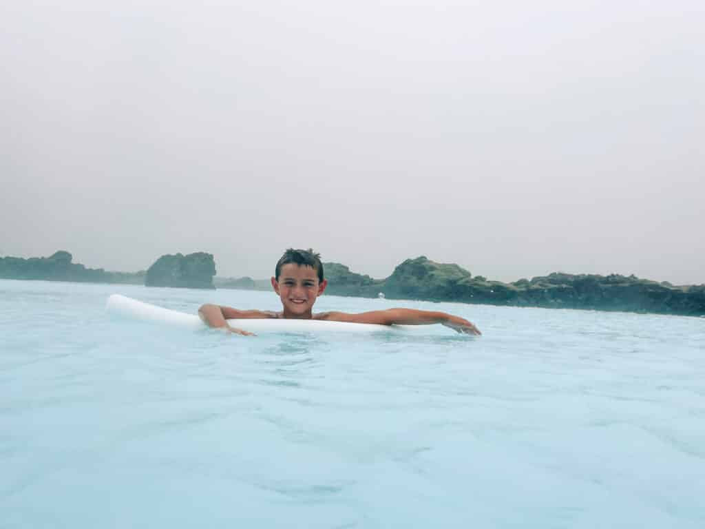 my son swimming in the Lagoon at Silica Hotel in Iceland