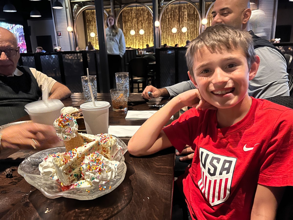 my son eating dessert at The Chocolate Factory at CityWalk