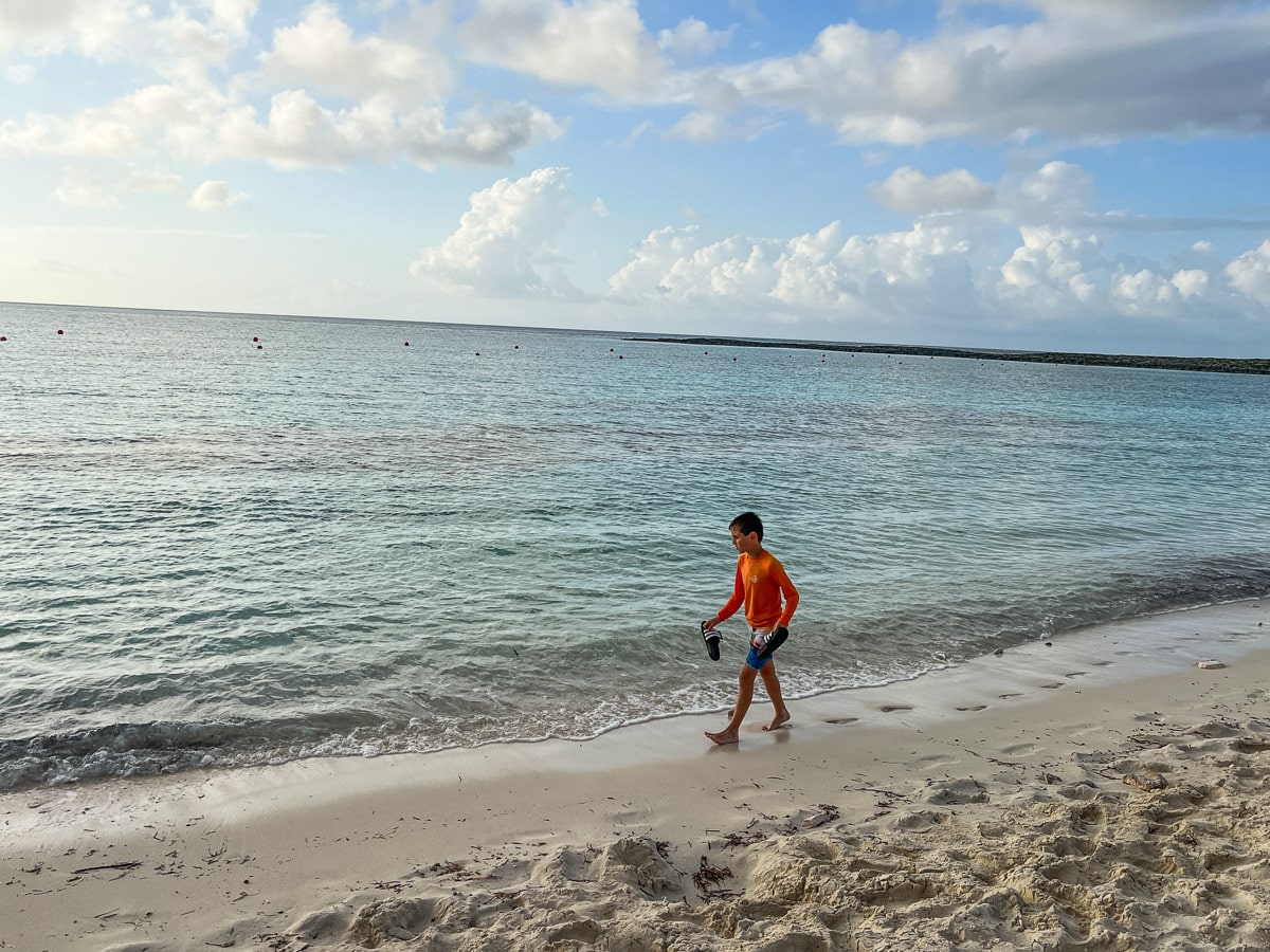 my son walking the beach at Atlantis