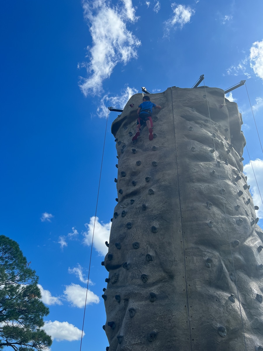 climbing the rock wall at westgate river ranch