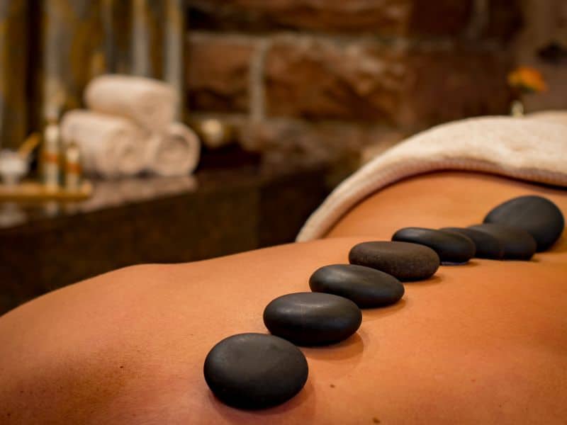 woman getting a hot stone massage