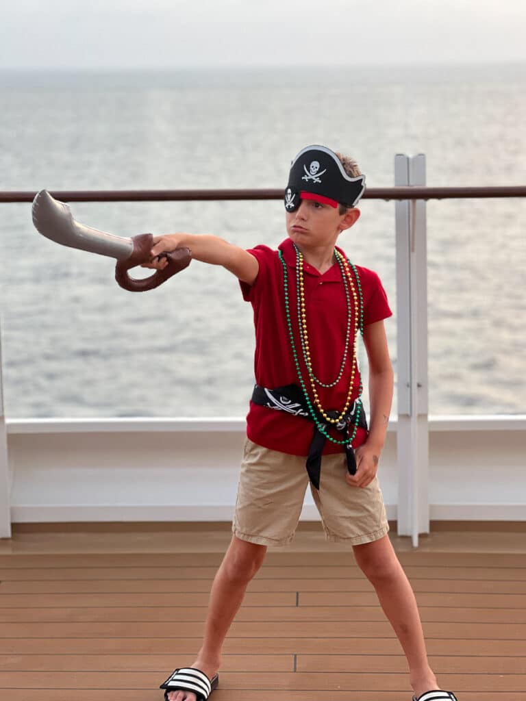 my son dressed up for pirate night on the Disney Wish cruise ship