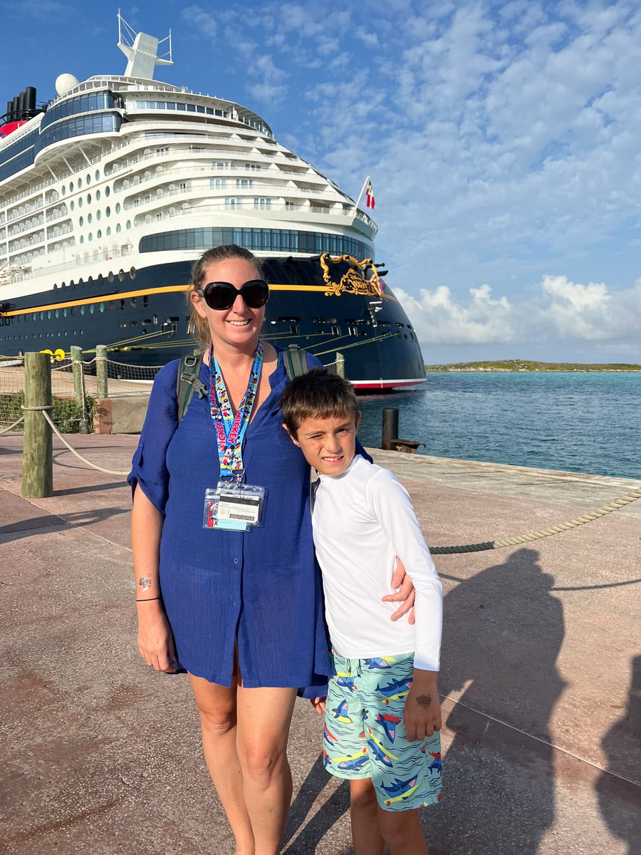 me and my son in front of the Disney Wish at Castaway Cay