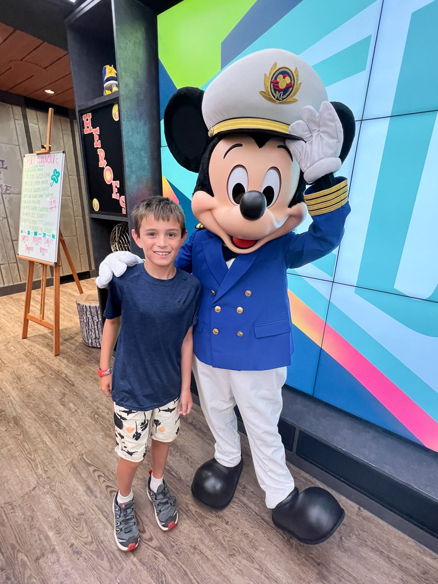 my son with Mickey Mouse on the Disney Wish