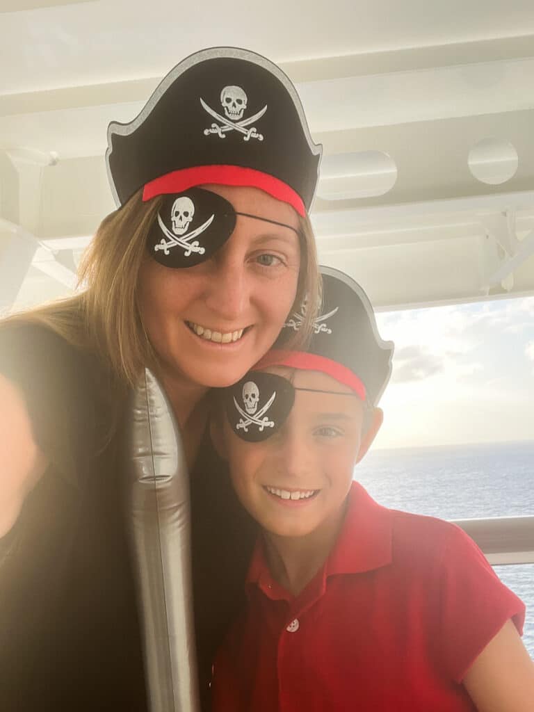 me and my son dressed up for pirate night on the Disney Wish cruise ship
