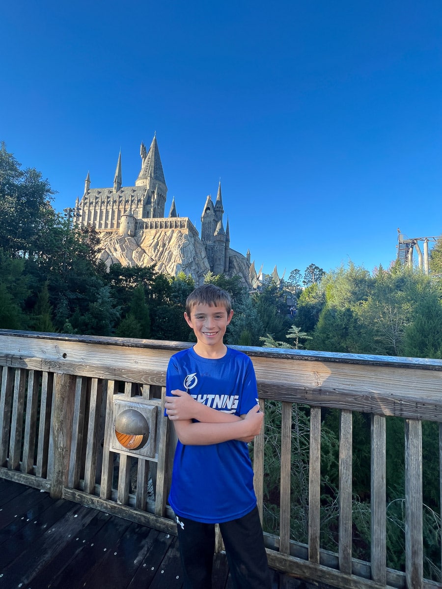 my son in front of Hogwart's at Universal Studios