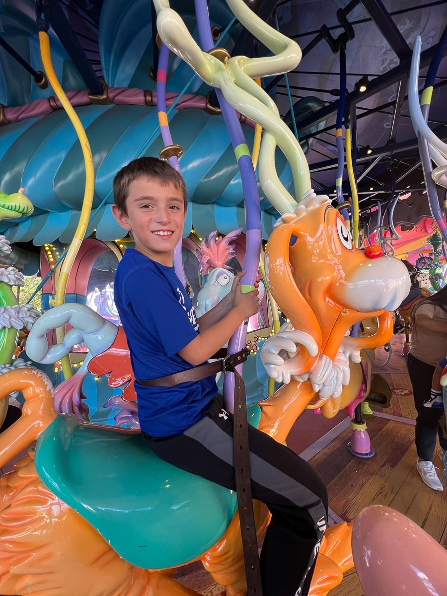 My son riding the carousel in Seuss Landing at Islands of Adventure