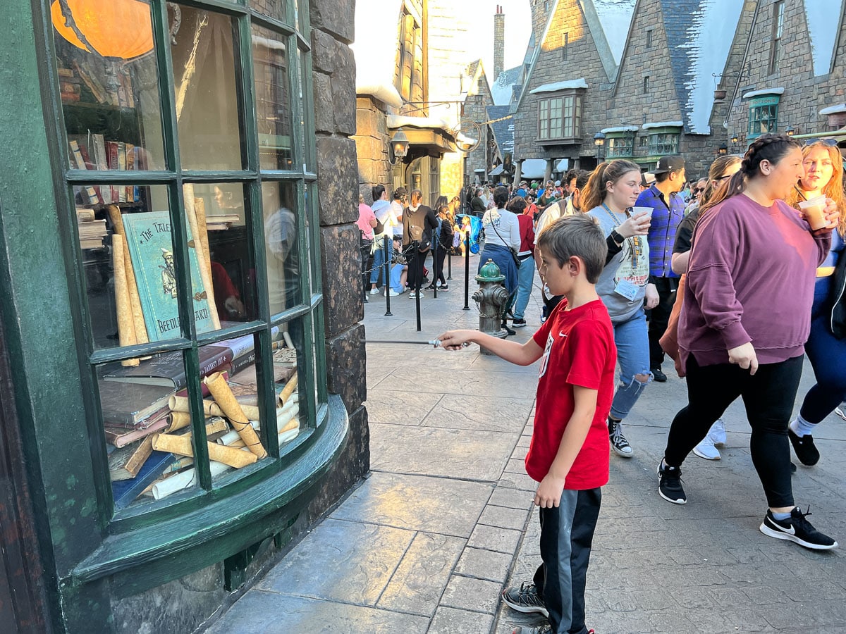 my son doing magic spells at Harry Potter world at Islands of Adventure