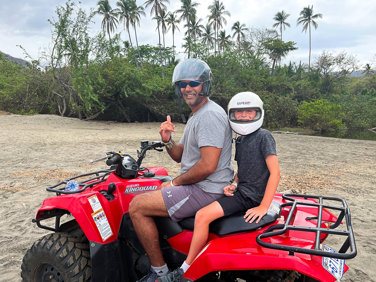 my husband and son on an ATV at Diamante Eco Adventure Park