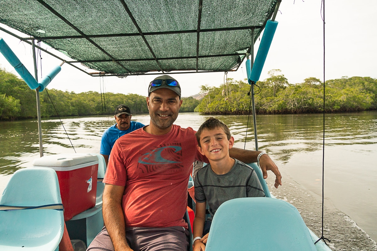 my husband and son on a boat tour of Tamarindo Estuary