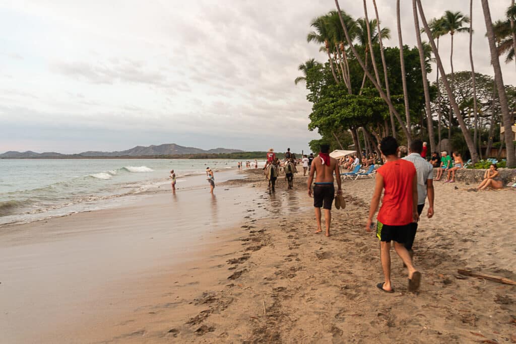 busy crowds on the beach in Tamarindo