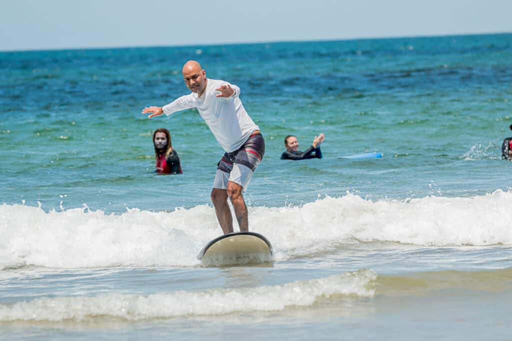 my husband surfing in Tamarindo Costa Rica