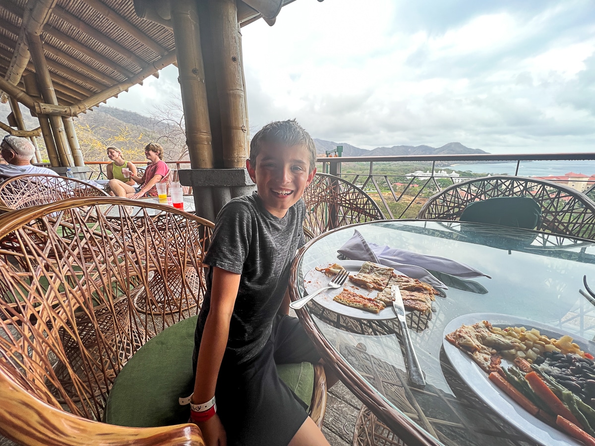 my son eating lunch at Diamante Eco Adventure Park in Costa Rica