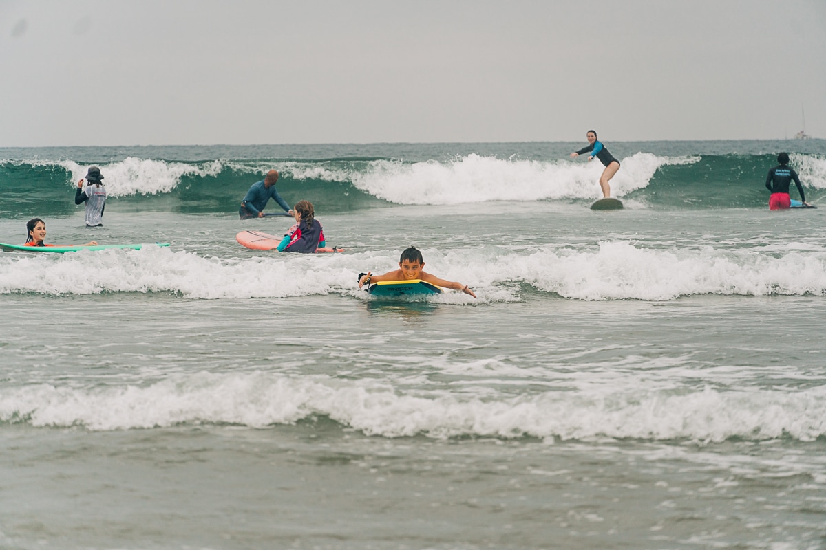 chaotic surfers in Tamarindo