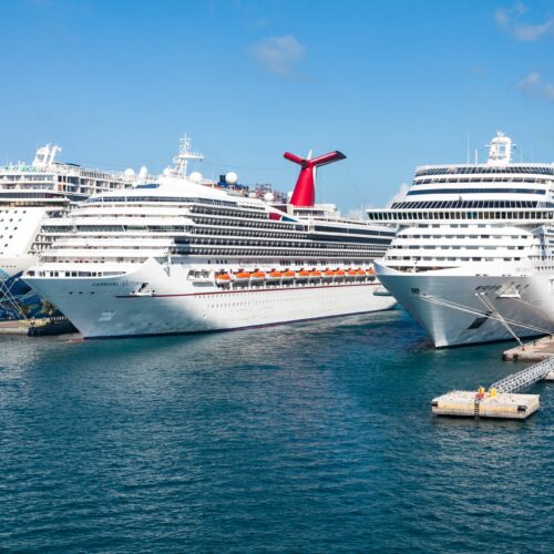 three cruise ships side-by-side in port