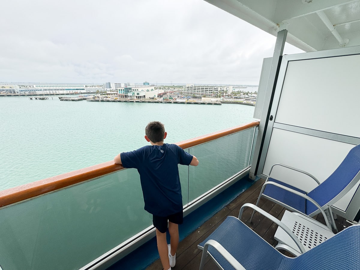 my son checking out our balcony on the Carnival Freedom