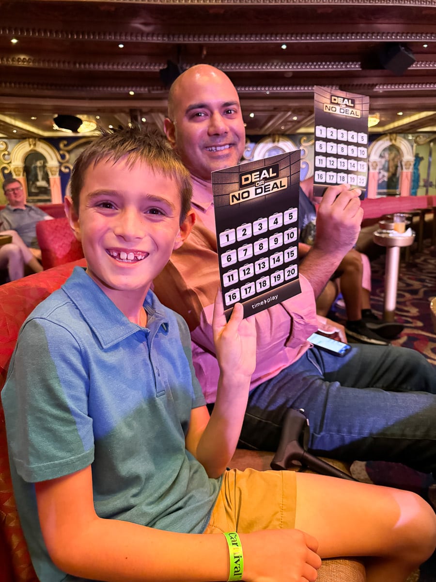 my husband and son playing deal or no deal on the ship