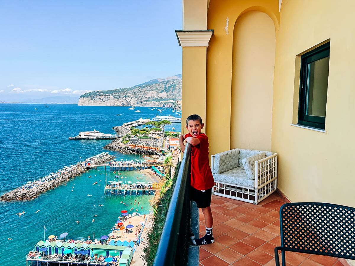 my son on the balcony of our junior suite