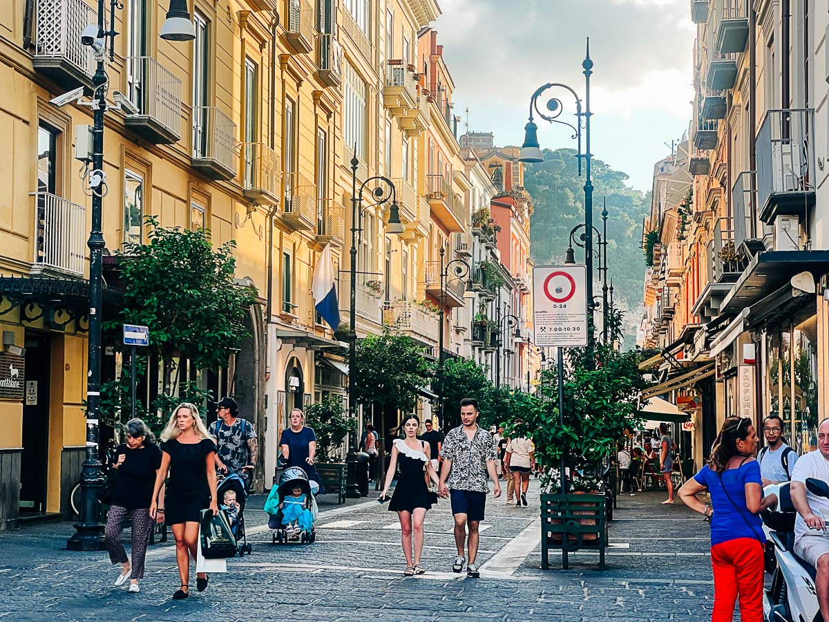 couple walking down the street in downtown sorrento