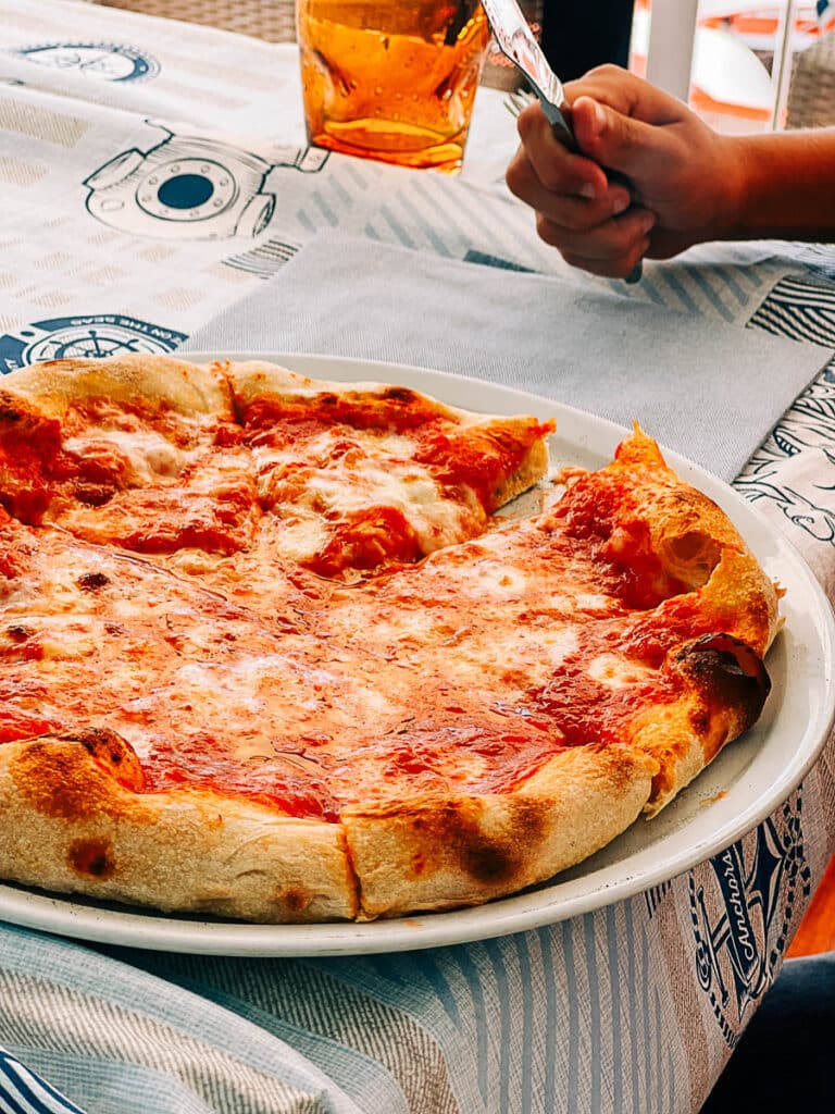 eating pizza in Amalfi